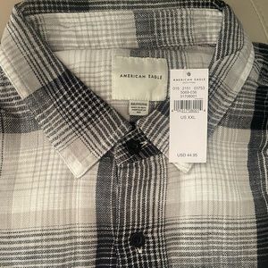 Never worn flannel plaid buttons down.